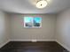 Bright bedroom with neutral walls and hardwood floors at 762 S Simms St, Lakewood, CO 80228