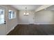 Bright dining room with hardwood floors and modern chandelier at 762 S Simms St, Lakewood, CO 80228