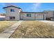 Updated Ranch home exterior boasts a fresh coat of paint and landscaping at 762 S Simms St, Lakewood, CO 80228