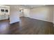 Open concept living area with dark hardwood floors at 762 S Simms St, Lakewood, CO 80228