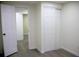 Good-sized bedroom with double door closet and wood-look floors at 11638 Community Center Dr # 20, Northglenn, CO 80233