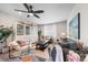 Relaxing living room with comfortable seating and built-in shelving at 3958 N Riviera Ct, Aurora, CO 80019