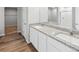 Modern bathroom with granite countertops and double sinks at 2235 Alyssa St, Fort Lupton, CO 80621