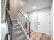 Modern staircase with metal railing leading to upper level at 1470 S Quebec Way # 62, Denver, CO 80231