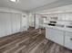 Open kitchen with white cabinets and breakfast bar at 1058 W 88Th Ave, Thornton, CO 80260