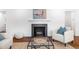 Modern fireplace with white mantel in living room at 545 S Harrison Ln, Denver, CO 80209