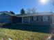 Brick ranch house with blue siding and a two-car garage at 13974 E Arkansas Pl, Aurora, CO 80012