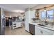 Updated kitchen with an island, stainless steel appliances, and farmhouse sink at 747 S 10Th Ave, Brighton, CO 80601