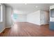 Open concept living room with wood-look floors and lots of natural light at 3292 N Highlands Creek Pkwy, Aurora, CO 80019