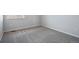 Simple carpeted bedroom with neutral walls and window at 3292 N Highlands Creek Pkwy, Aurora, CO 80019