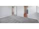 Spacious bedroom with carpet flooring and access to other rooms at 3292 N Highlands Creek Pkwy, Aurora, CO 80019