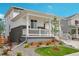 Charming two-story home with front porch and landscaping at 3292 N Highlands Creek Pkwy, Aurora, CO 80019