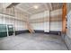 Unfinished garage with concrete floor and stairway access at 3292 N Highlands Creek Pkwy, Aurora, CO 80019