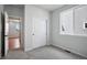Bright bedroom with carpet flooring and view into another room at 3292 N Highlands Creek Pkwy, Aurora, CO 80019