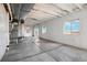 Unfinished basement with windows and concrete floor at 3292 N Highlands Creek Pkwy, Aurora, CO 80019