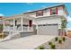 Two-story home with front porch, attached garage, and landscaping at 3292 N Highlands Creek Pkwy, Aurora, CO 80019