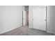 Well-lit bedroom featuring carpet and double door closet at 3292 N Highlands Creek Pkwy, Aurora, CO 80019