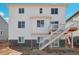 Two-story house with deck and stairs in backyard at 3292 N Highlands Creek Pkwy, Aurora, CO 80019