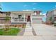 Two-story home with attached garage and landscaping at 3292 N Highlands Creek Pkwy, Aurora, CO 80019