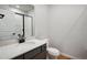 Modern bathroom with gray vanity and white quartz countertop at 3292 N Highlands Creek Pkwy, Aurora, CO 80019