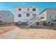 Two-story house with deck and stairs in backyard at 3292 N Highlands Creek Pkwy, Aurora, CO 80019