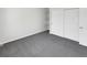 Bright bedroom featuring grey carpeting and a double door closet at 22975 E Ontario Dr # 101, Aurora, CO 80016