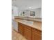 Kitchen with double sink, light countertops, and wood cabinets at 22975 E Ontario Dr # 101, Aurora, CO 80016