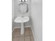 Clean powder room with pedestal sink and tile floor at 22975 E Ontario Dr # 101, Aurora, CO 80016
