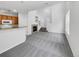 Open living area with a view into the kitchen and a fireplace at 22975 E Ontario Dr # 101, Aurora, CO 80016