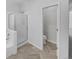 Bathroom with shower, toilet and herringbone tile floor at 22975 E Ontario Dr # 101, Aurora, CO 80016