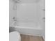 Bathroom with shower/tub combo and white tile surround at 22975 E Ontario Dr # 101, Aurora, CO 80016