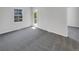 Bright bedroom with carpet and access to a deck at 22975 E Ontario Dr # 101, Aurora, CO 80016