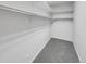 Spacious walk-in closet with double hanging rods and shelving at 22975 E Ontario Dr # 101, Aurora, CO 80016