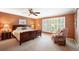 Spacious main bedroom with ensuite bathroom and wood furniture at 4505 S Yosemite S St # 371, Denver, CO 80237