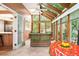 Sunroom with wicker furniture and access to the kitchen at 4505 S Yosemite S St # 371, Denver, CO 80237