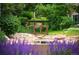Charming wooden footbridge crossing a small creek in a lush garden setting at 4505 S Yosemite S St # 371, Denver, CO 80237