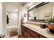 Bathroom with granite countertop, large mirror, and bathtub at 4505 S Yosemite S St # 371, Denver, CO 80237