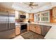 Bright kitchen with stainless steel appliances and light wood cabinets at 4505 S Yosemite S St # 371, Denver, CO 80237