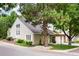 Side view of two-story townhome with mature trees at 4505 S Yosemite S St # 371, Denver, CO 80237