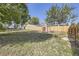 Large backyard with grass, shed, and wooden fence at 4822 Bryant St, Denver, CO 80221