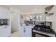 Modern kitchen with stainless steel appliances and a breakfast bar at 4822 Bryant St, Denver, CO 80221