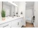 Modern bathroom with white vanity, quartz countertop and bathtub at 1133 Race St # 1B, Denver, CO 80206