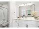 Clean bathroom with white vanity, modern mirror, and updated fixtures at 1133 Race St # 1B, Denver, CO 80206