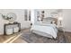 Spacious bedroom with large windows, hardwood floors, and a neutral color palette at 1133 Race St # 1B, Denver, CO 80206