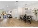 Modern dining area with a stylish table and chairs, adjacent to a kitchen at 1133 Race St # 1B, Denver, CO 80206