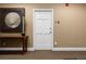 Building entry with a modern white door and tasteful decor at 1133 Race St # 1B, Denver, CO 80206