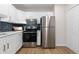 Modern kitchen with stainless steel appliances and white cabinets at 1133 Race St # 1B, Denver, CO 80206
