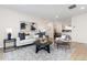 Bright living room with comfy seating, large windows, and stylish decor at 1133 Race St # 1B, Denver, CO 80206