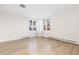 Spacious living room featuring hardwood floors and large windows at 1133 Race St # 1B, Denver, CO 80206