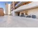 Private patio with building exterior and parking lot view at 1133 Race St # 1B, Denver, CO 80206